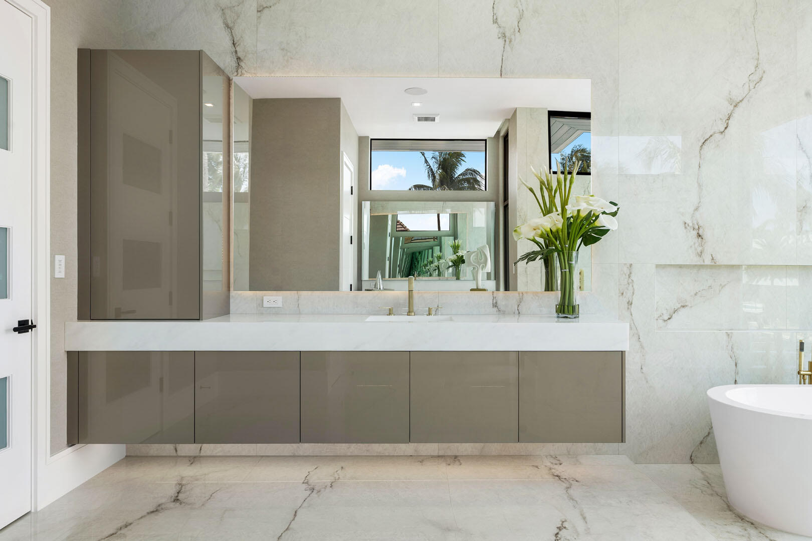 169 Coconut Palm Road Boca Raton, FL 33432 - Photo 48 of 84 a bathroom with a tub shower and sink