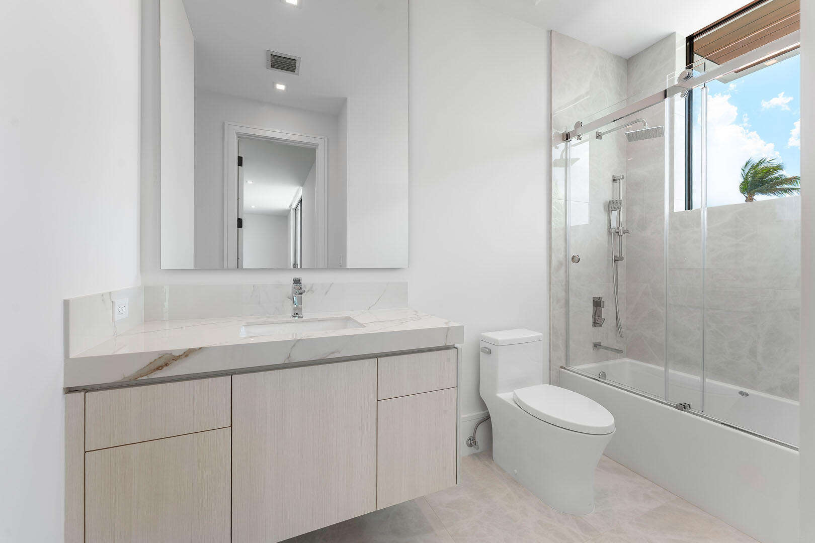 169 Coconut Palm Road Boca Raton, FL 33432 - Photo 51 of 84 a bathroom with a sink a toilet and shower