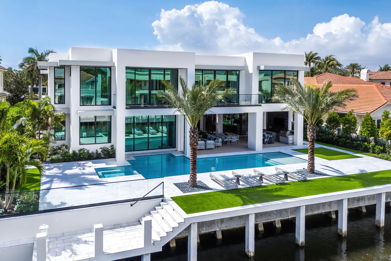 169 Coconut Palm Road Boca Raton, FL 33432 - Photo 77 of 84 a view of an house with swimming pool and porch