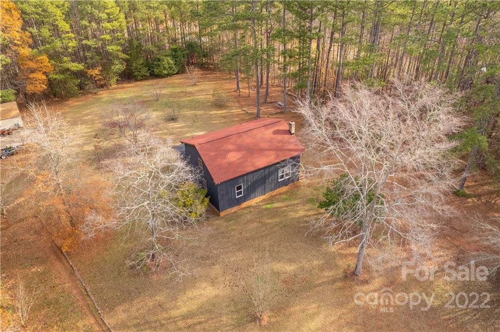 1191 Ross Road Blackstock, SC 29014 - Photo 5 of 36 a backyard of a house with large trees