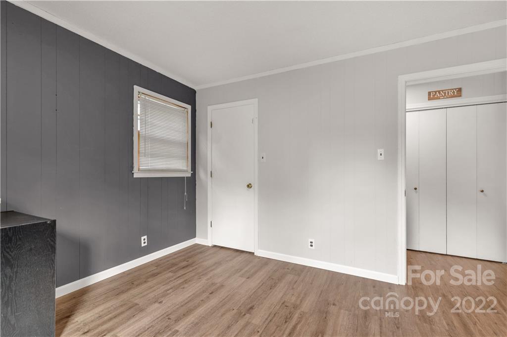 1191 Ross Road Blackstock, SC 29014 - Photo 7 of 36 a view of an empty room with wooden floor and a window