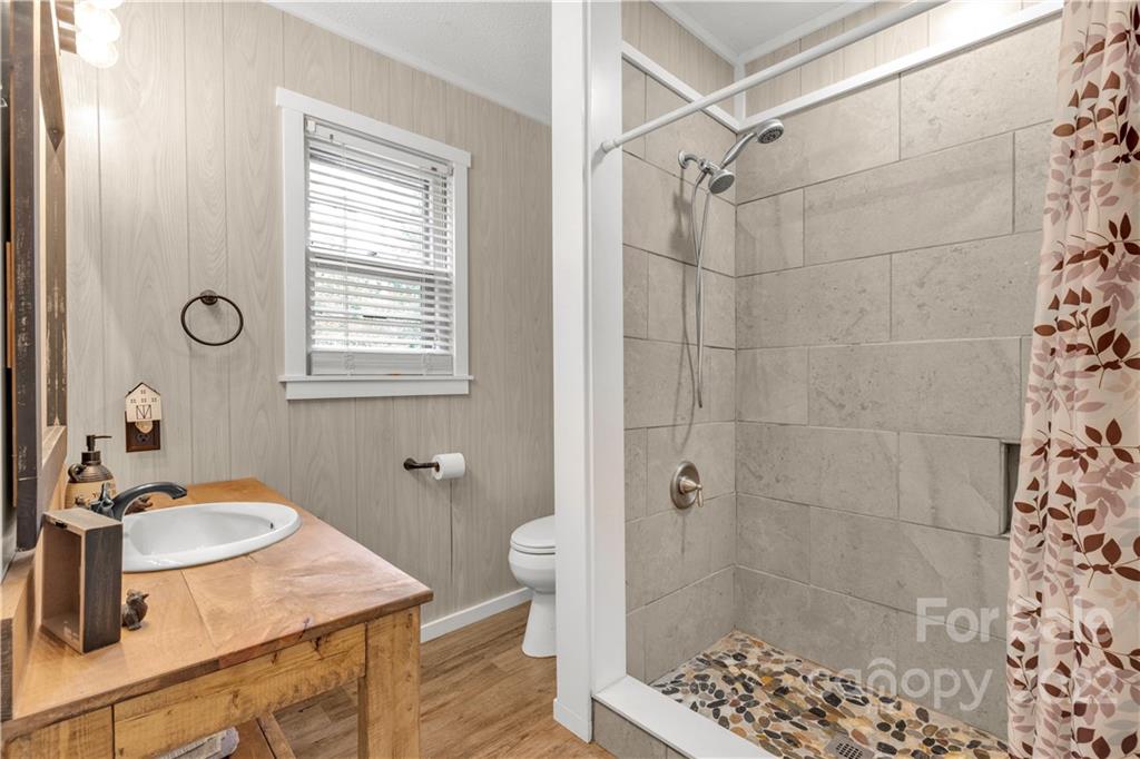 1191 Ross Road Blackstock, SC 29014 - Photo 8 of 36 a bathroom with a sink shower and a mirror