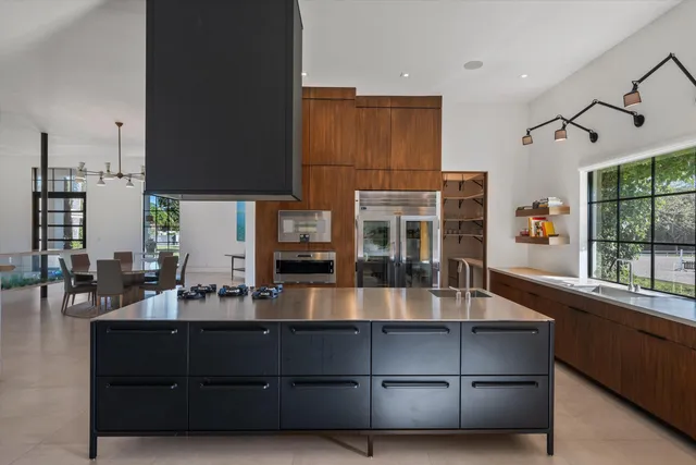 a spacious bathroom with a granite countertop sink and a mirror