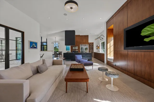 a view of swimming pool with outdoor seating and plants