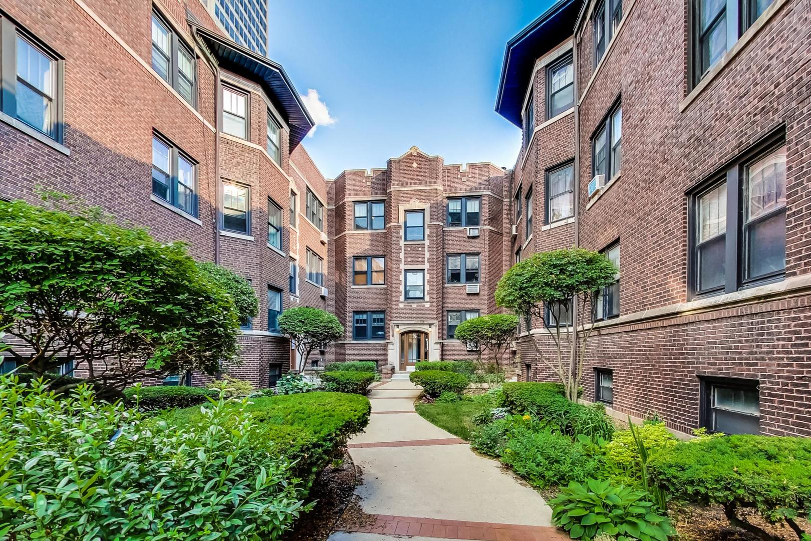 a view of a building next to a yard
