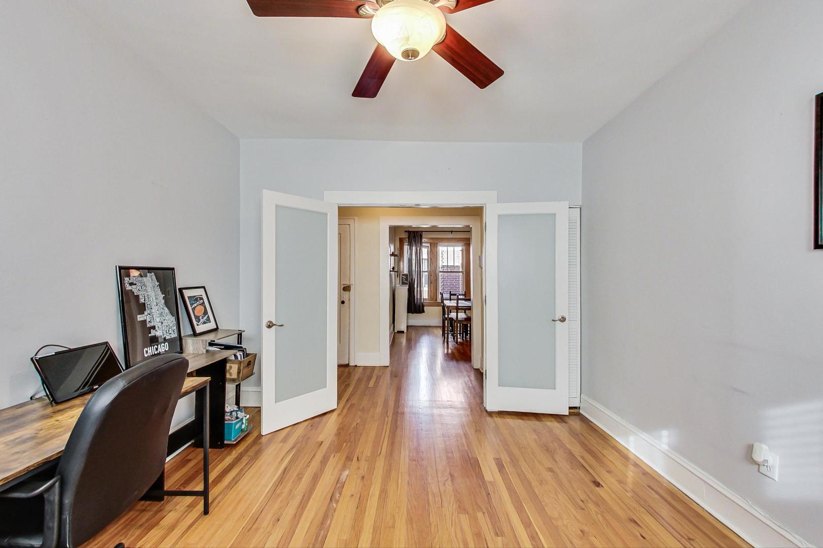 537 West Addison Street, Unit 3S Chicago, IL 60613 - Photo 15 of 19 a view of a hallway with a workspace