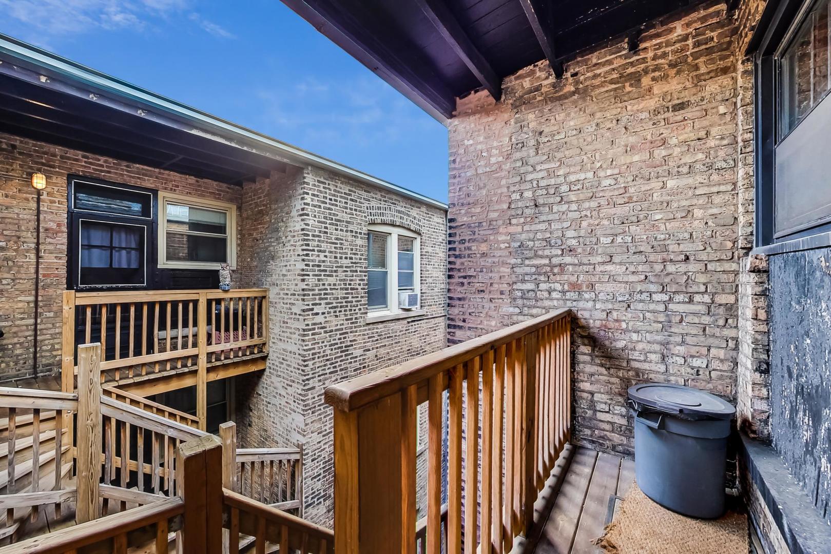 537 West Addison Street, Unit 3S Chicago, IL 60613 - Photo 18 of 19 a view of front door of house with stairs