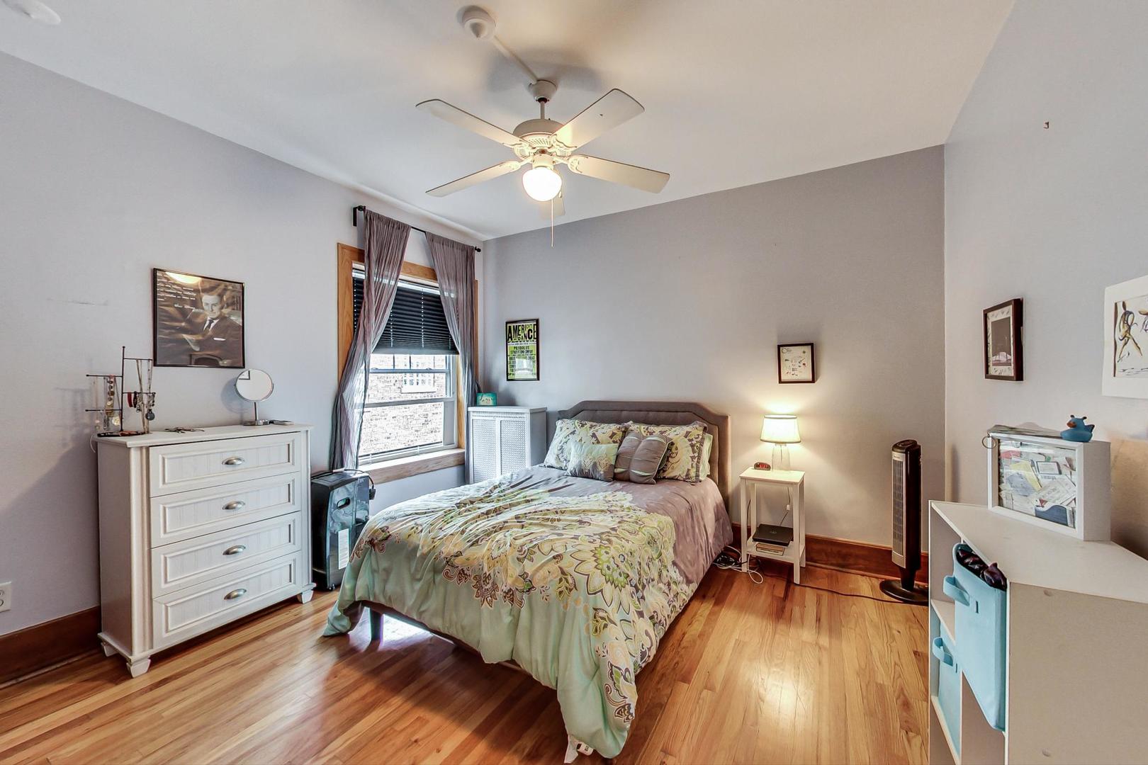 537 West Addison Street, Unit 3S Chicago, IL 60613 - Photo 10 of 19 a bedroom with a bed and a dresser