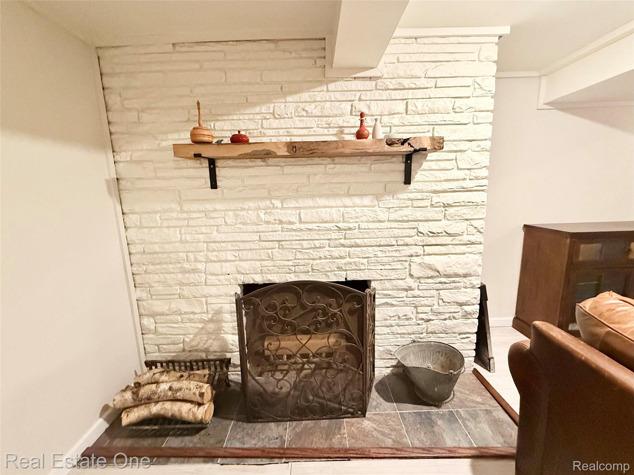 2189 Devonshire Road Bloomfield Hills, MI 48302 - Photo 32 of 50 Wood burning fireplace in the basement. Cozy up and watch a movie!