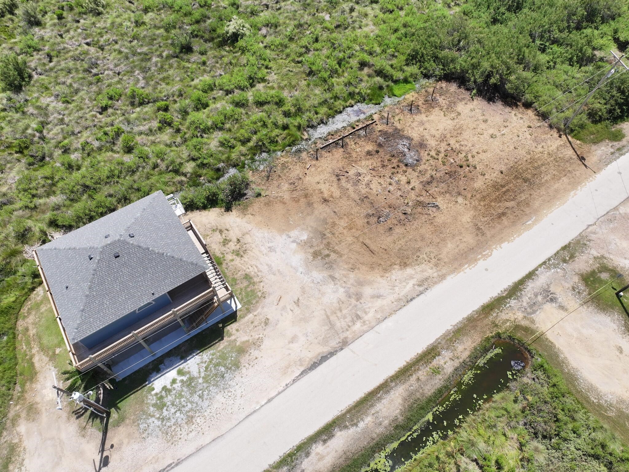 21 Faggards Road Port Bolivar, TX 77650 - Photo 12 of 13 a view of a yard with wooden fence