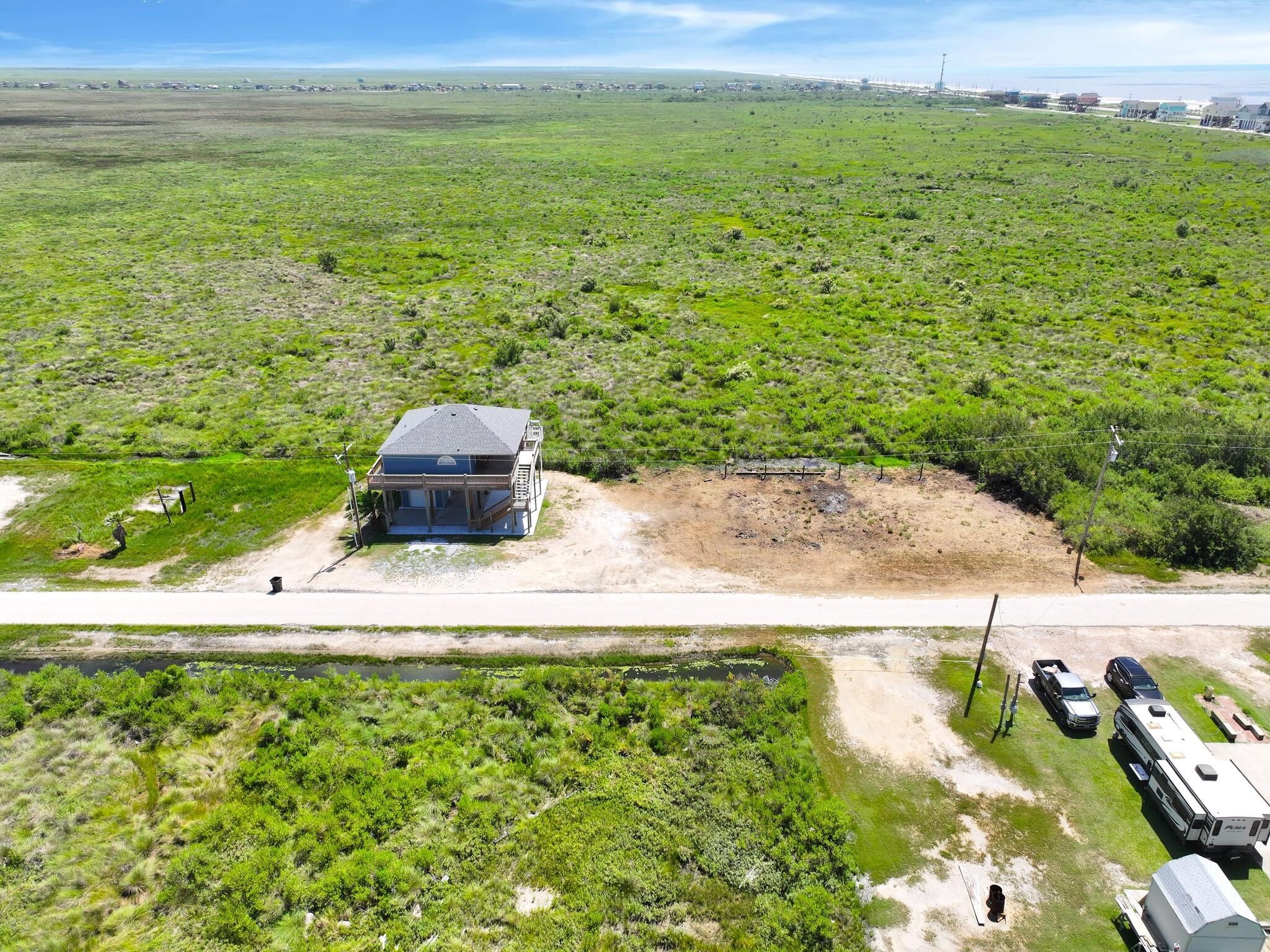 21 Faggards Road Port Bolivar, TX 77650 - Photo 13 of 13 a view of a lake with a yard