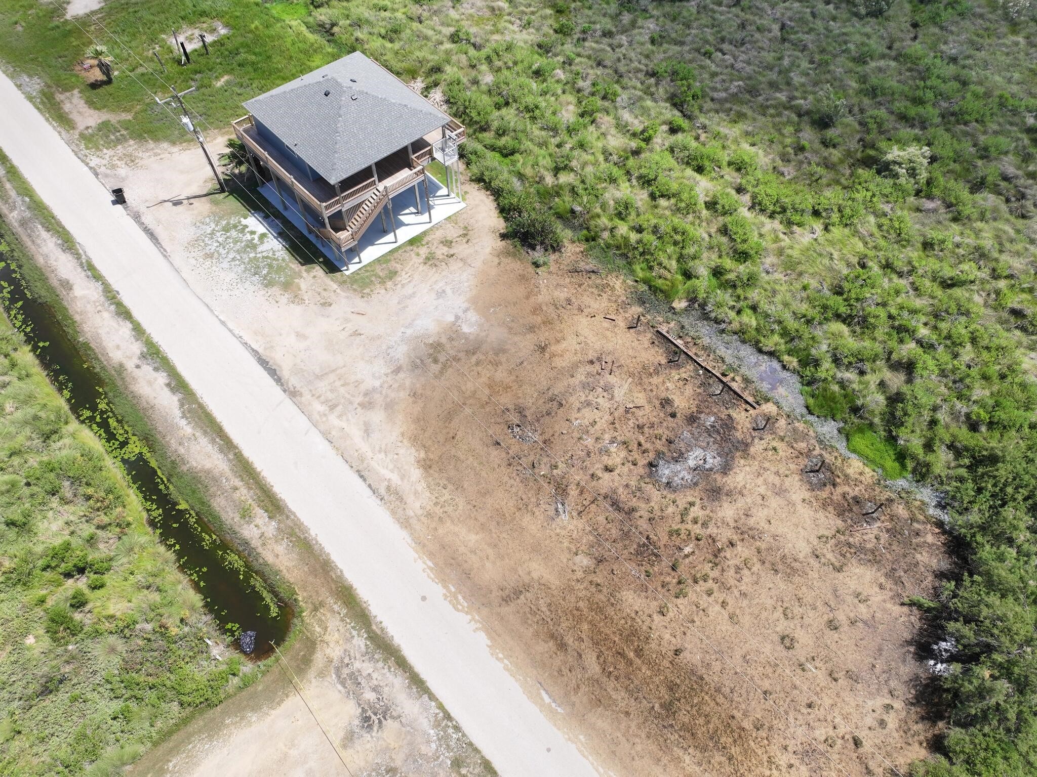 21 Faggards Road Port Bolivar, TX 77650 - Photo 6 of 13 a view of a back yard with a bench