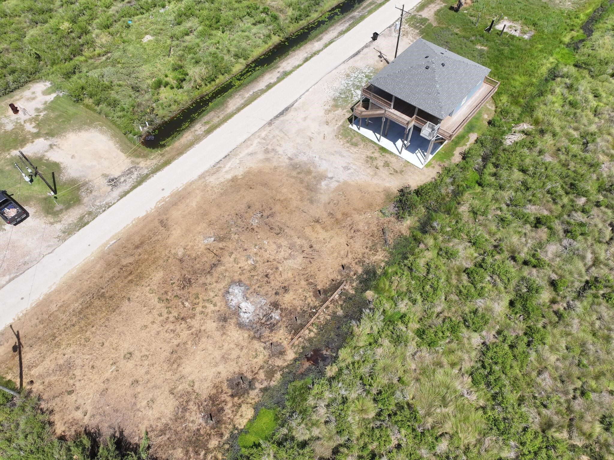 21 Faggards Road Port Bolivar, TX 77650 - Photo 8 of 13 a view of a bench in a yard