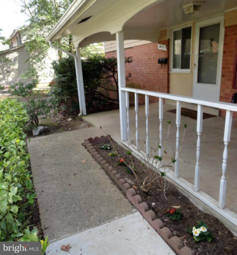 8711 Victoria Road Springfield, VA 22151 - Photo 14 of 15 a view of a house with a yard