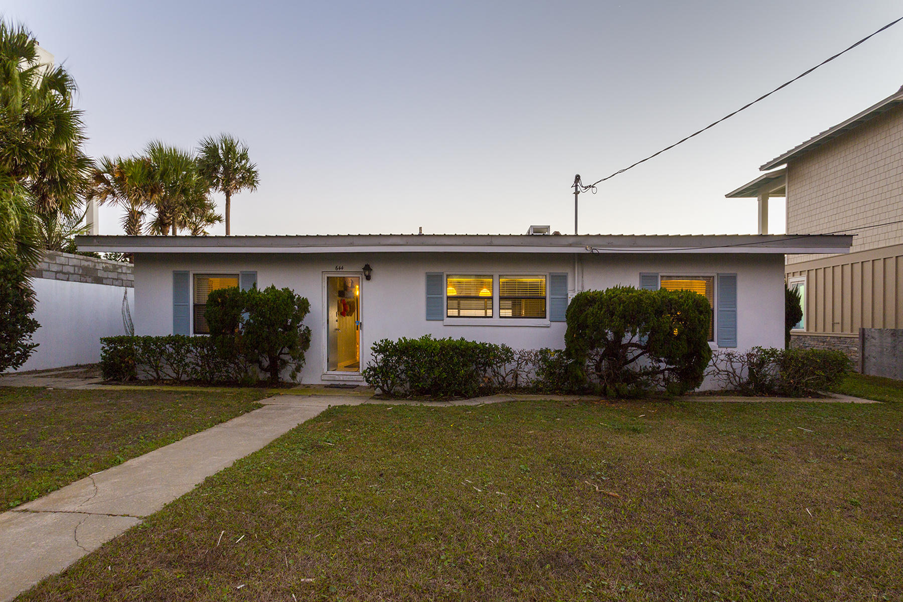 644 Blue Mountain Road Santa Rosa Beach, FL 32459 - Photo 2 of 17 a front view of a house with garden