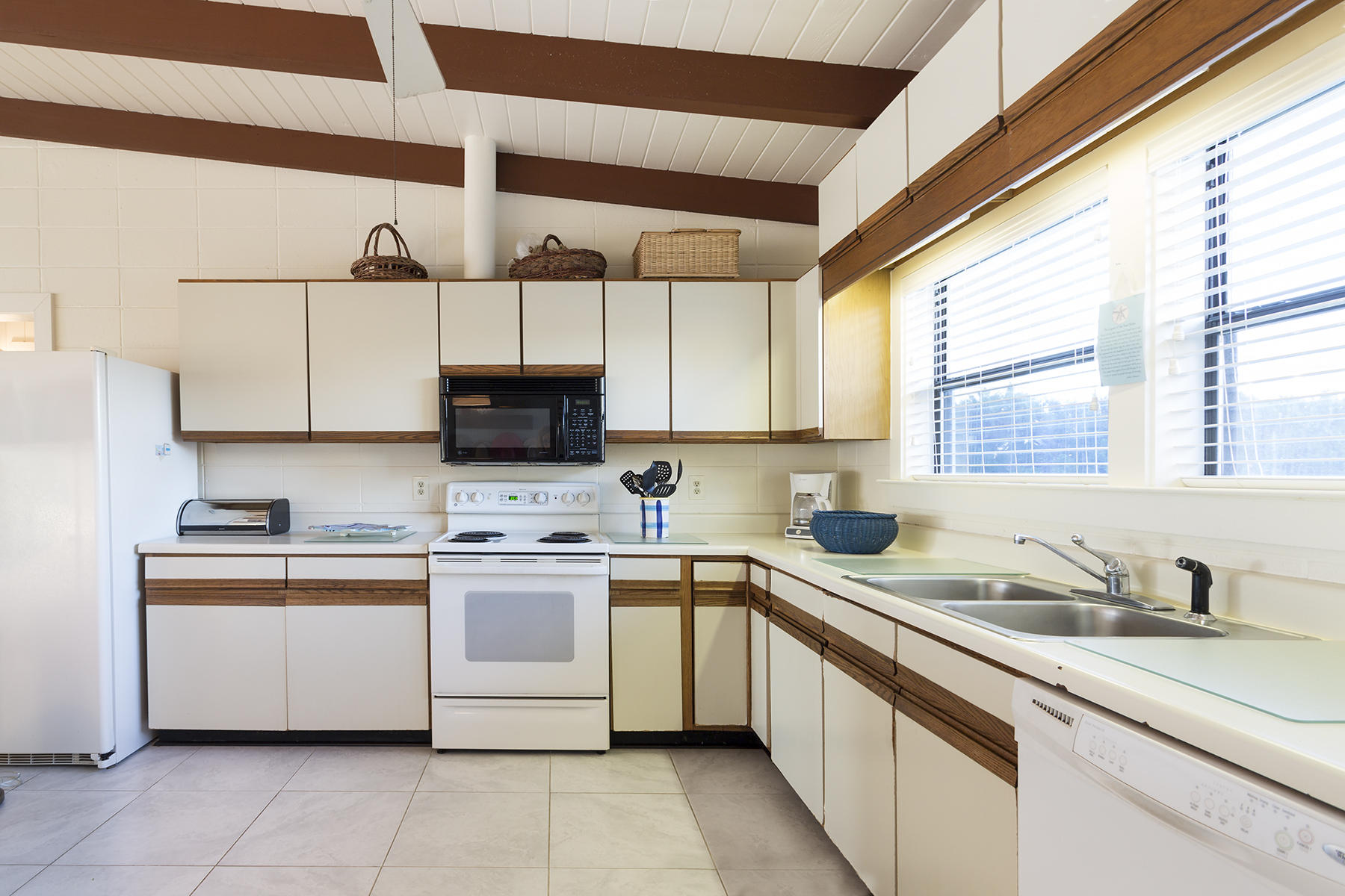 644 Blue Mountain Road Santa Rosa Beach, FL 32459 - Photo 6 of 17 a kitchen with appliances cabinets and a sink