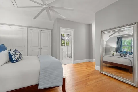 a bedroom with a bed and a walk in closet