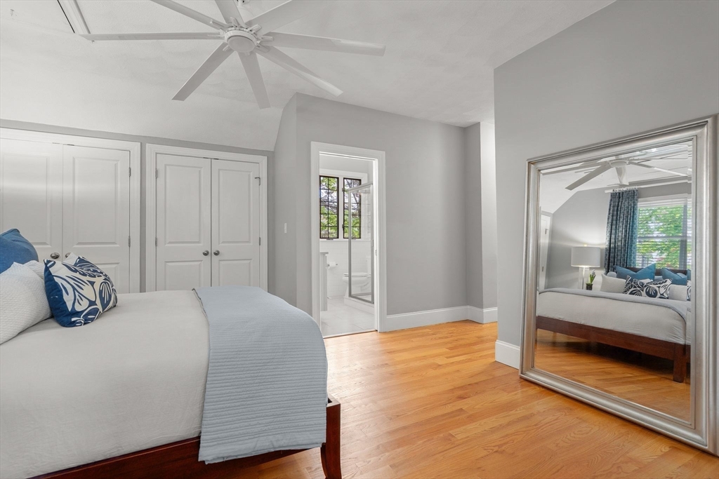 165 Park Avenue, Unit 165 Arlington, MA 02476 - Photo 13 of 32 a bedroom with a bed and a walk in closet