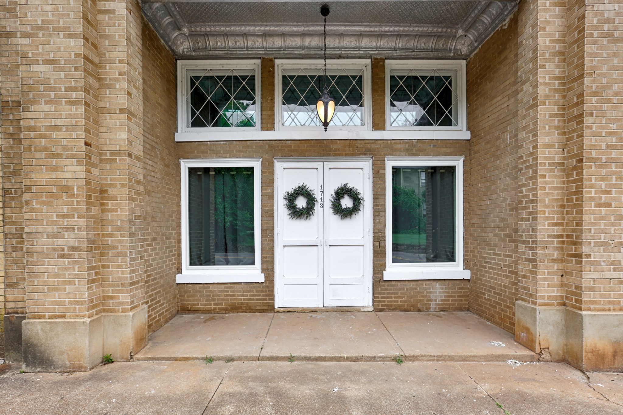 a view of a brick house with front door