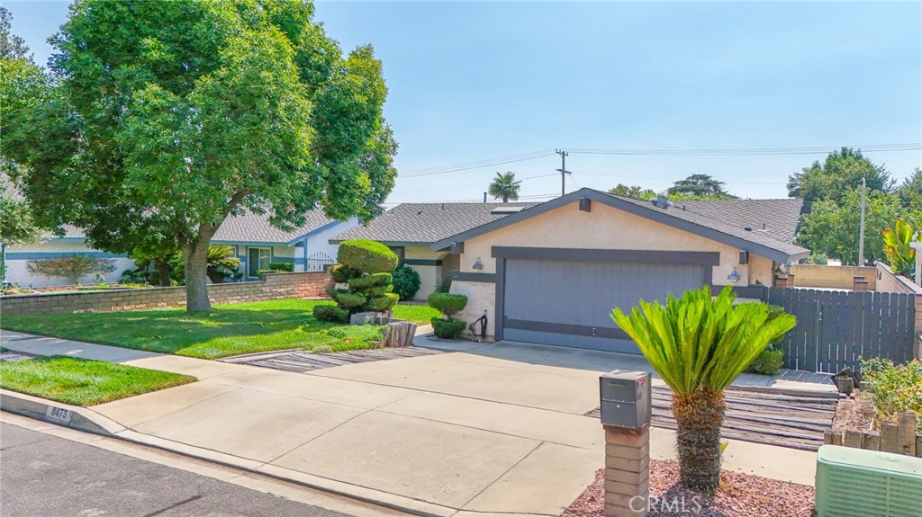 8473 Hawthorne Street Rancho Cucamonga, CA 91701 - Photo 1 of 1 a front view of a house with garden