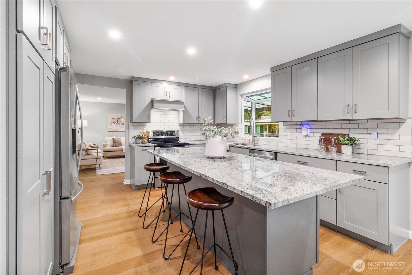 299 Friday Creek Road Bellingham, WA 98229 - Photo 12 of 36 a kitchen with stainless steel appliances granite countertop wooden cabinets a sink stove and refrigerator