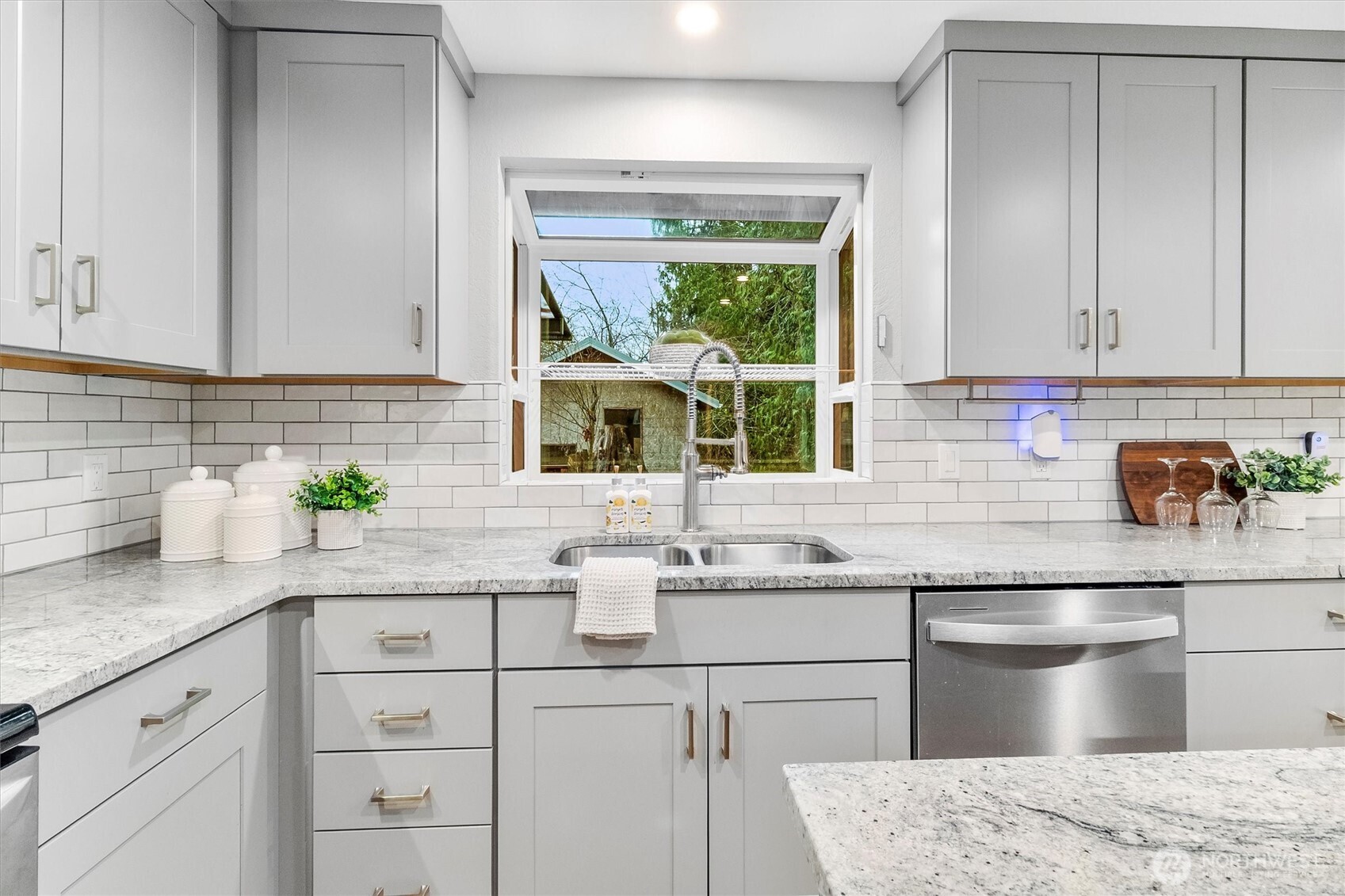 299 Friday Creek Road Bellingham, WA 98229 - Photo 15 of 36 a kitchen with granite countertop white cabinets and white appliances