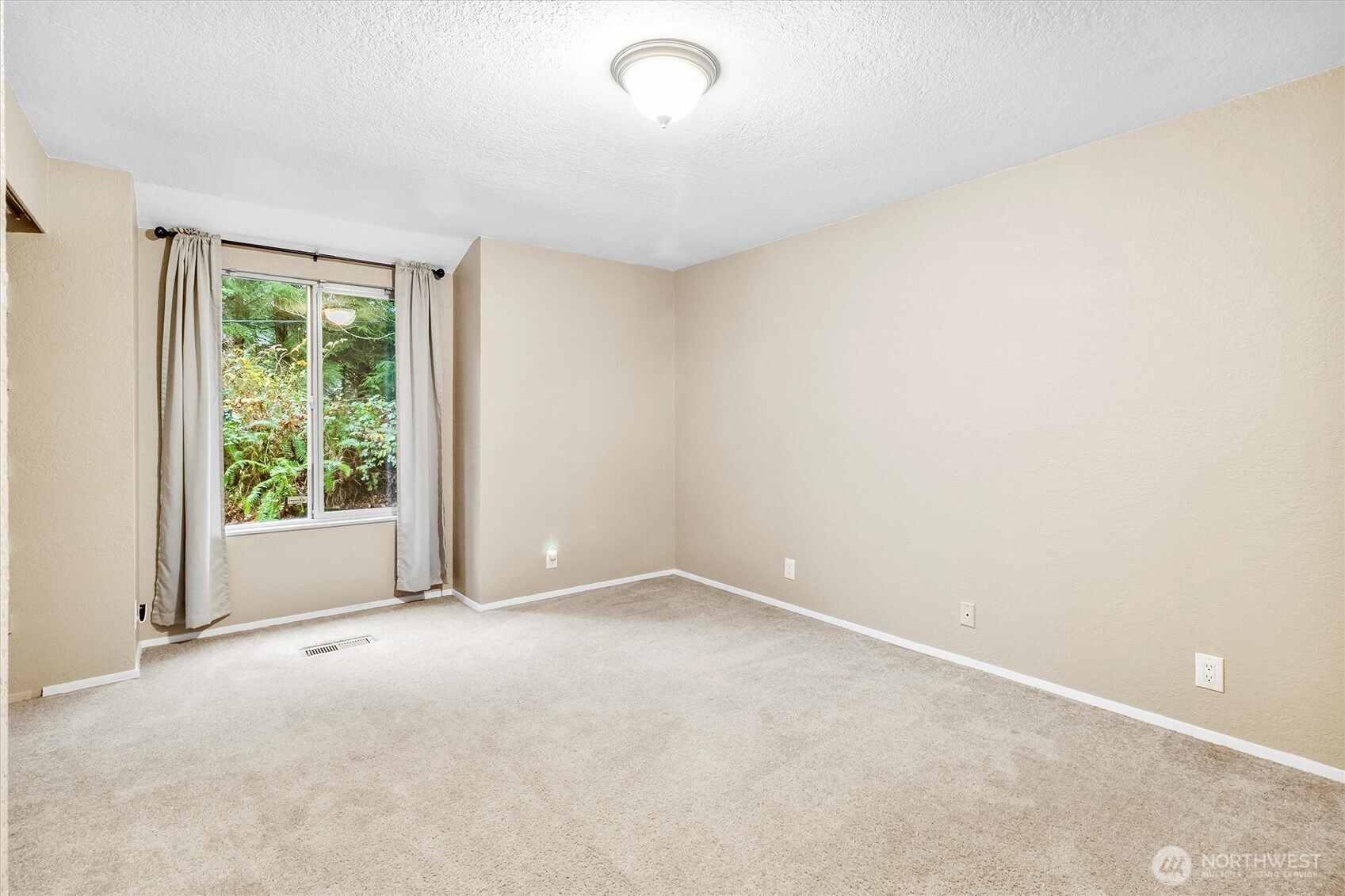 299 Friday Creek Road Bellingham, WA 98229 - Photo 20 of 36 a view of an empty room with a window