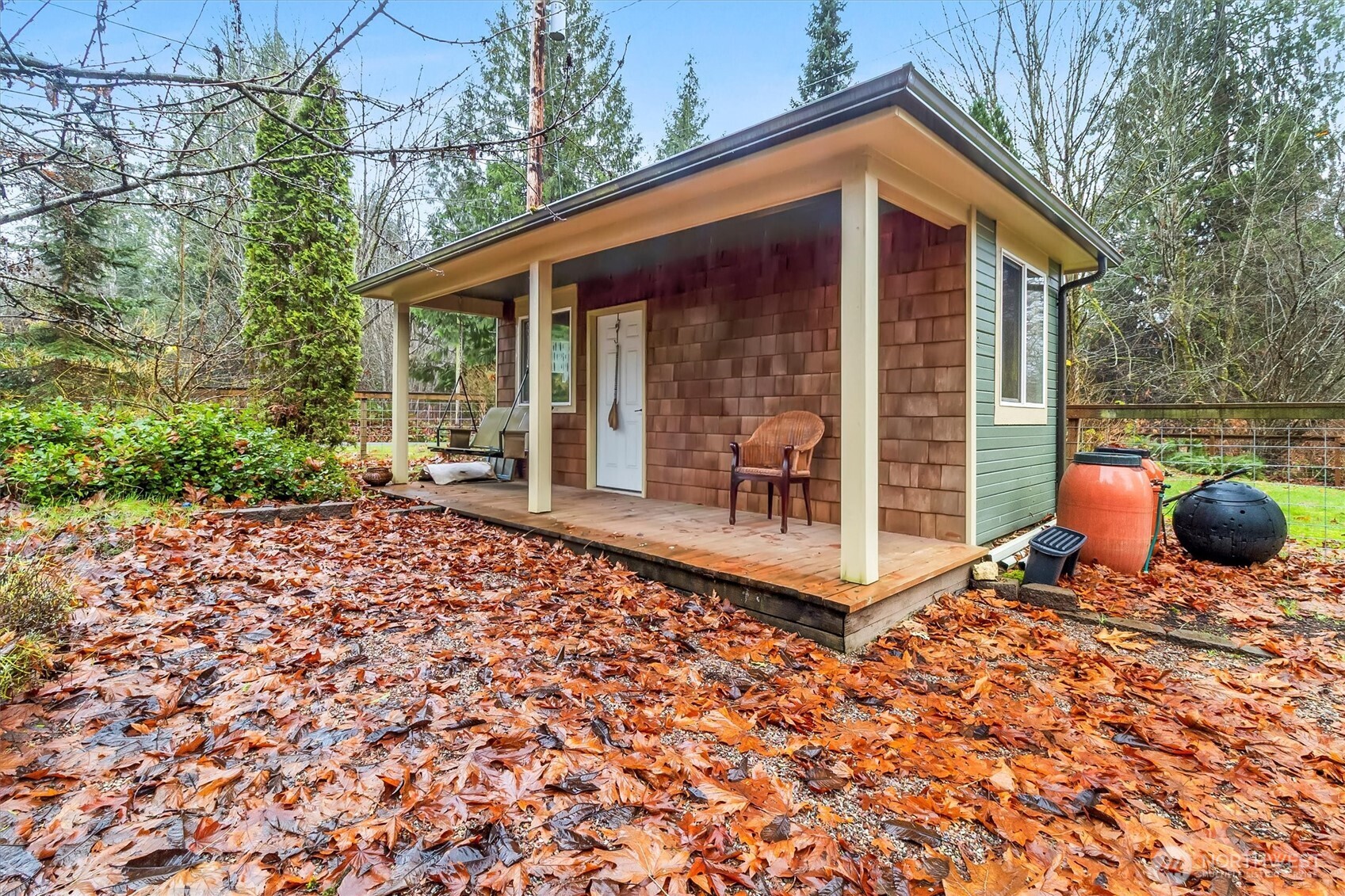 299 Friday Creek Road Bellingham, WA 98229 - Photo 23 of 36 a backyard of a house with table and chairs