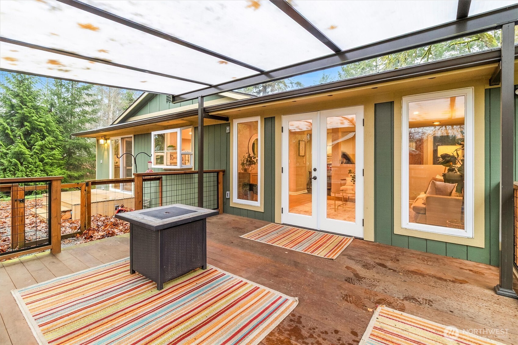 299 Friday Creek Road Bellingham, WA 98229 - Photo 27 of 36 a balcony with furniture and a potted plant