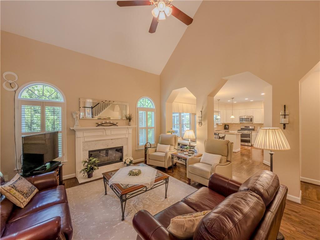 4284 Cedar Bluff Way Southwest Lilburn, GA 30047 - Photo 21 of 62 a living room with furniture fireplace and a flat screen tv