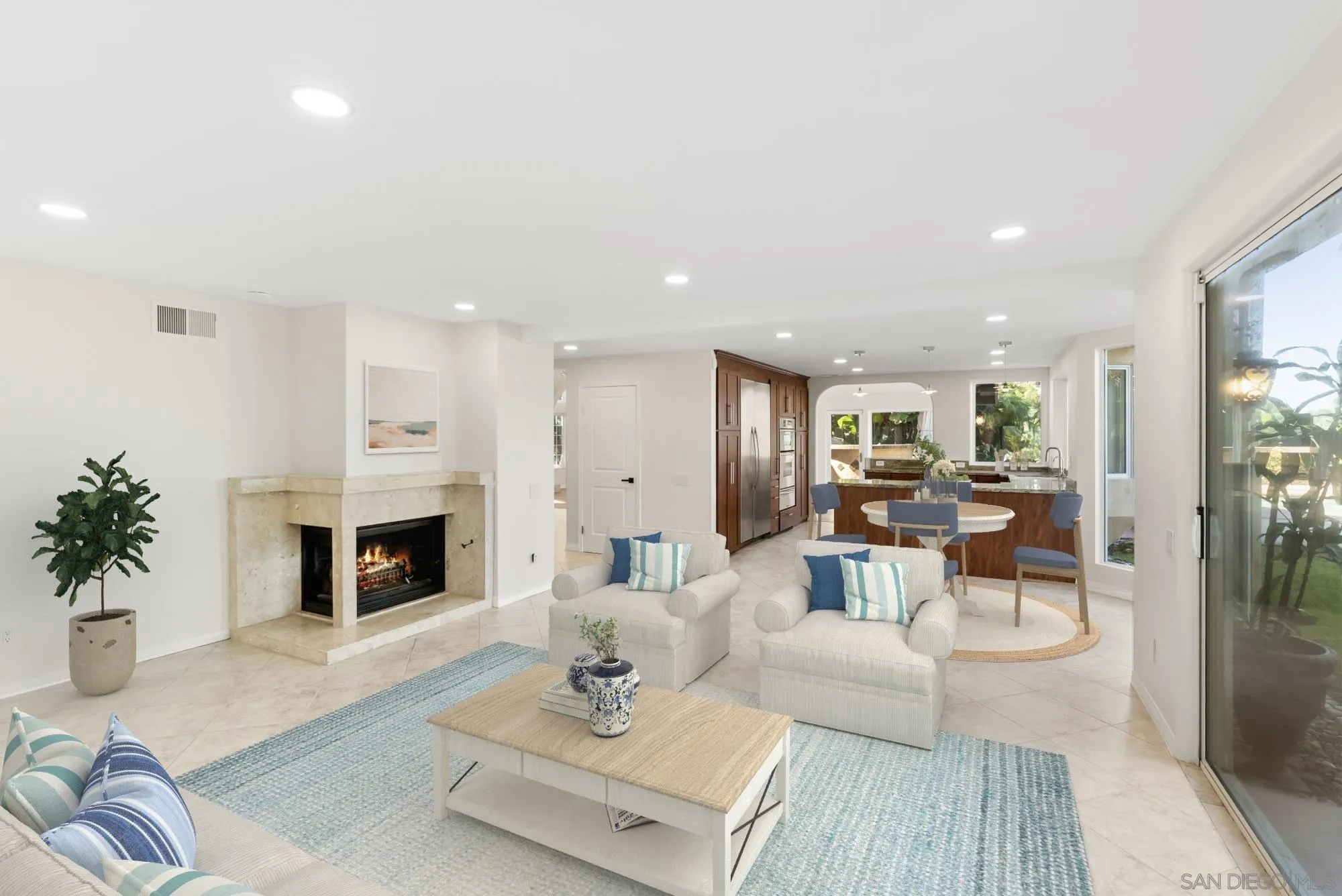 13404 Kibbings Road San Diego, CA 92130 - Photo 12 of 32 a living room with furniture fireplace and potted plant