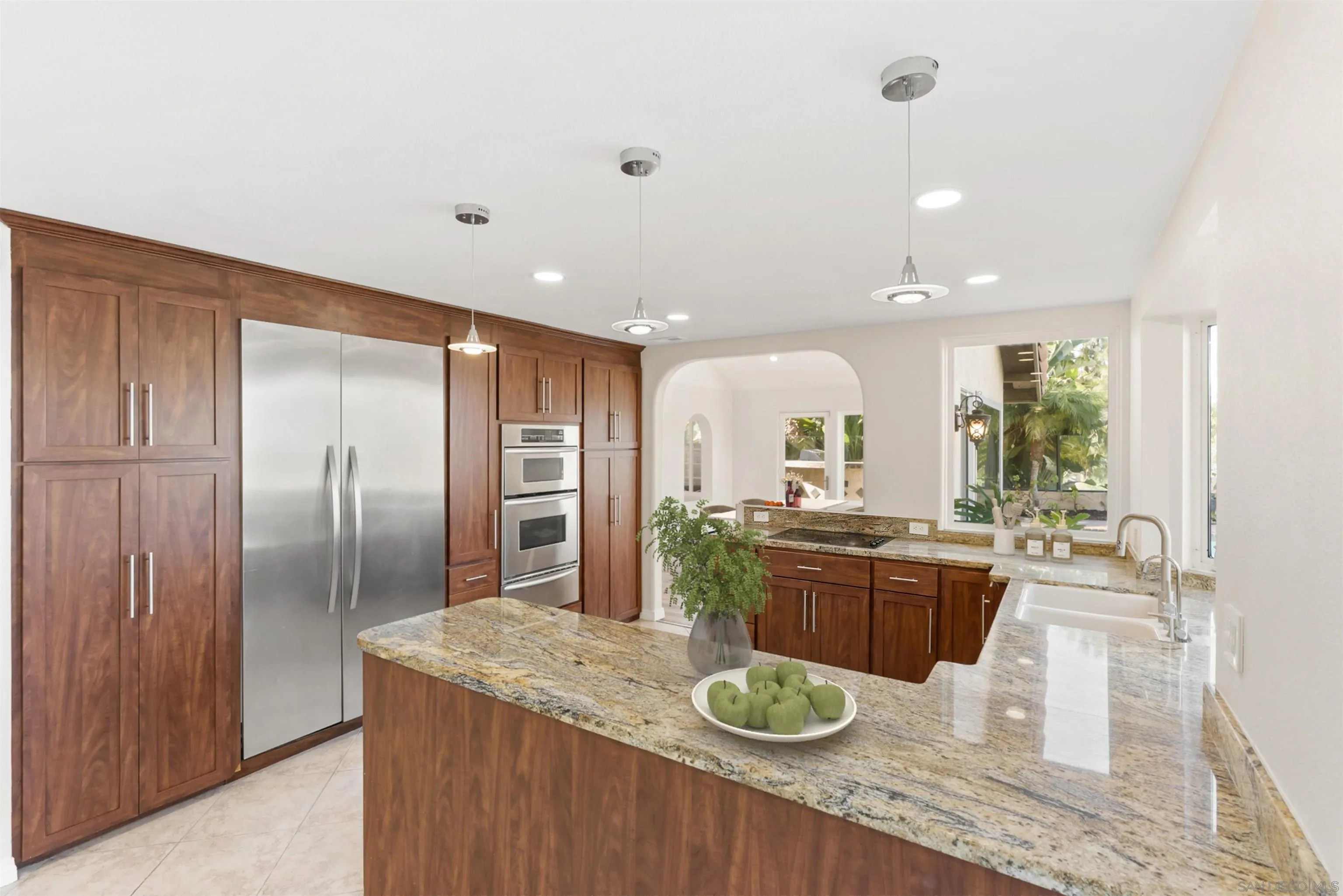 13404 Kibbings Road San Diego, CA 92130 - Photo 13 of 32 a kitchen with a table and chairs in it