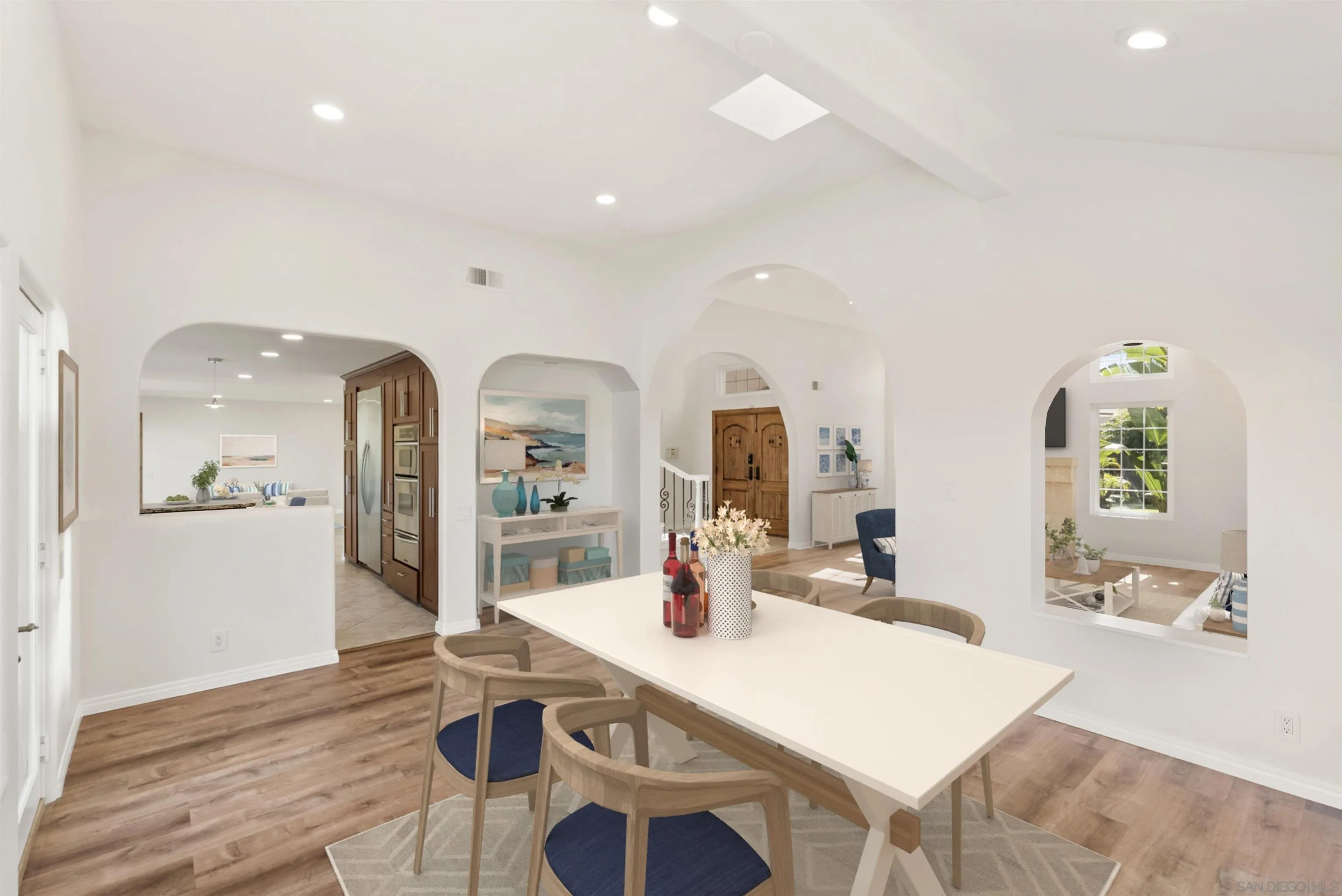 13404 Kibbings Road San Diego, CA 92130 - Photo 15 of 32 a living room with kitchen island furniture and wooden floor