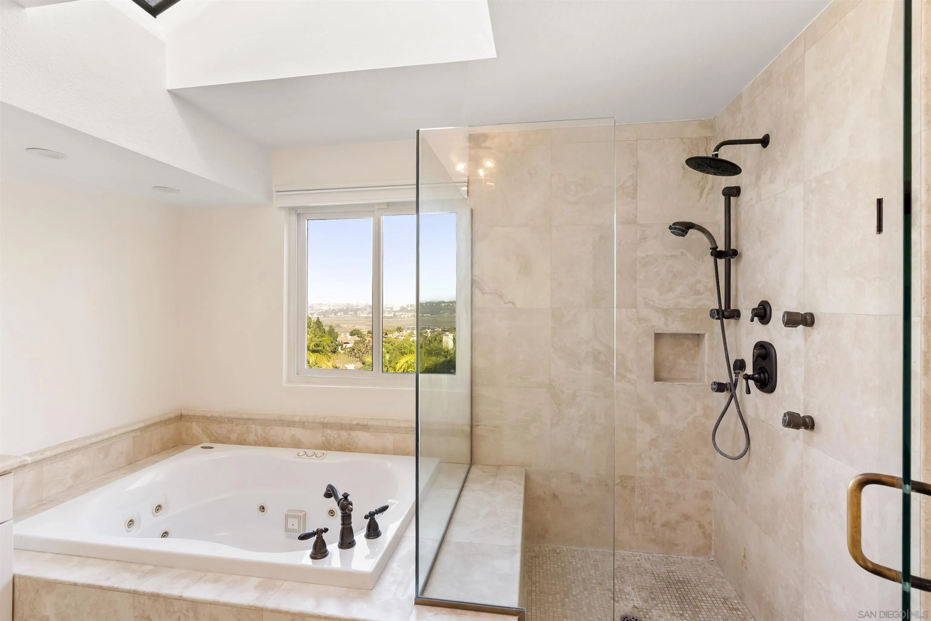 13404 Kibbings Road San Diego, CA 92130 - Photo 21 of 32 a bathroom with a bathtub
