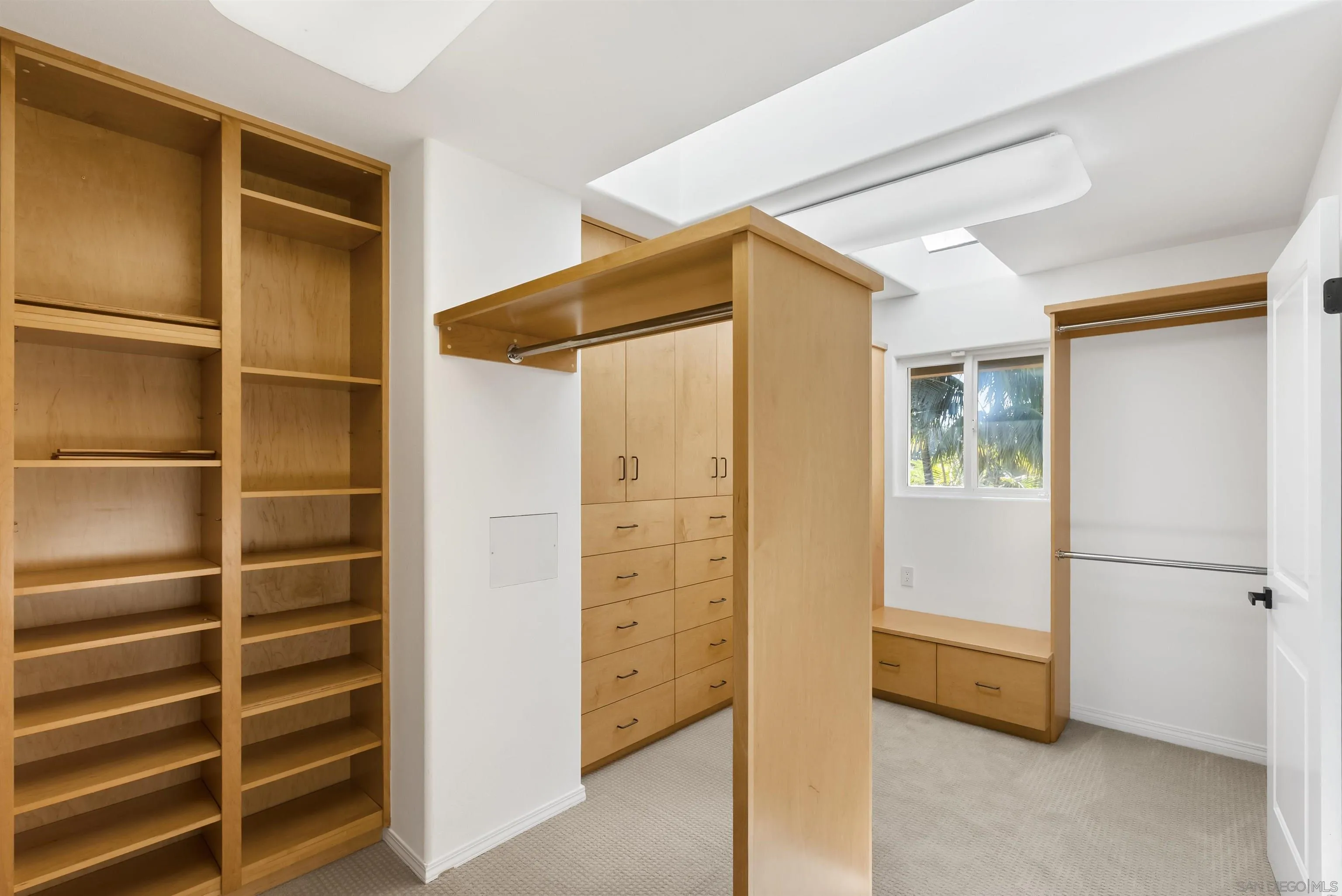 13404 Kibbings Road San Diego, CA 92130 - Photo 22 of 32 a view of walk in closet with empty racks