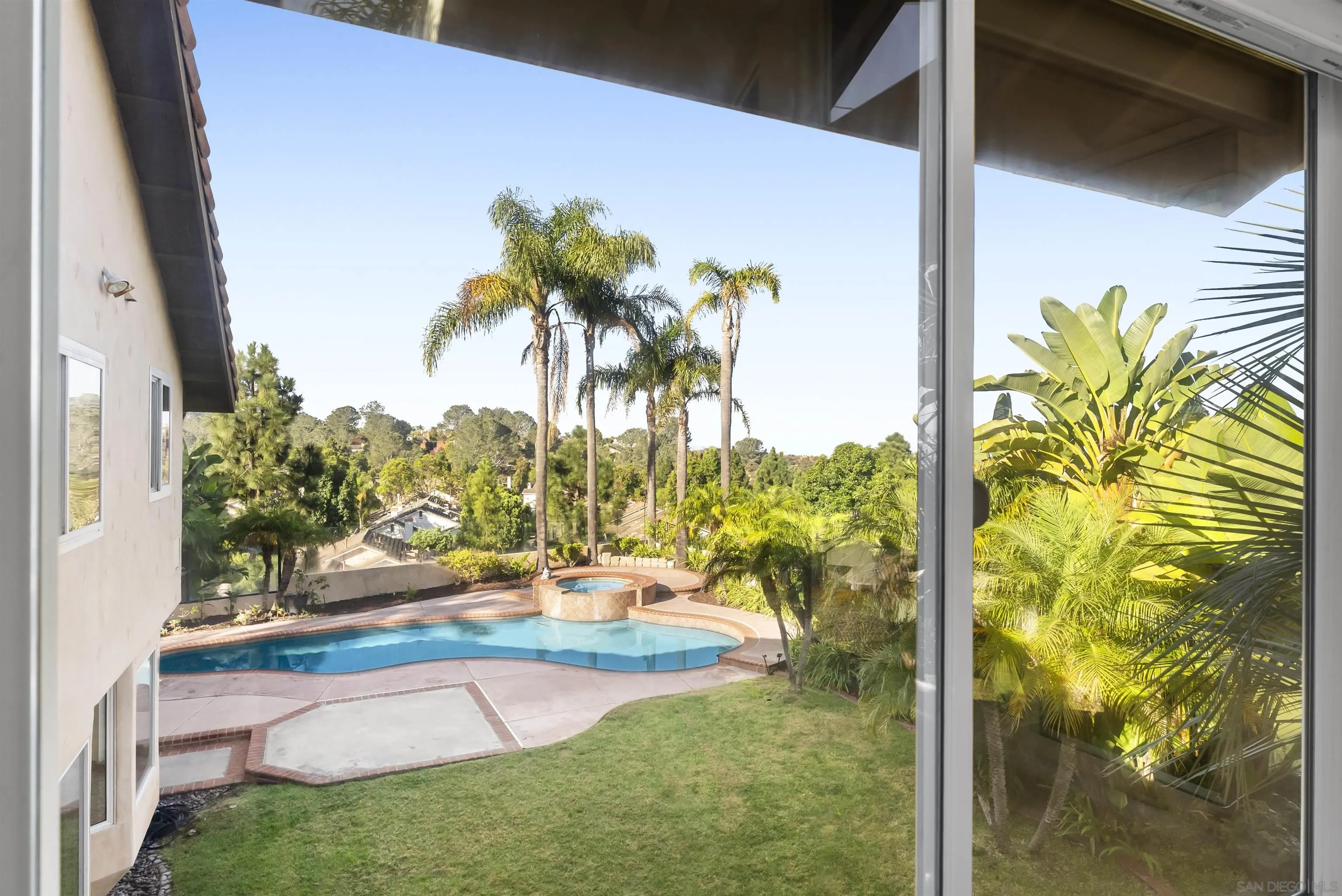 13404 Kibbings Road San Diego, CA 92130 - Photo 26 of 32 a view of swimming pool with a garden and patio