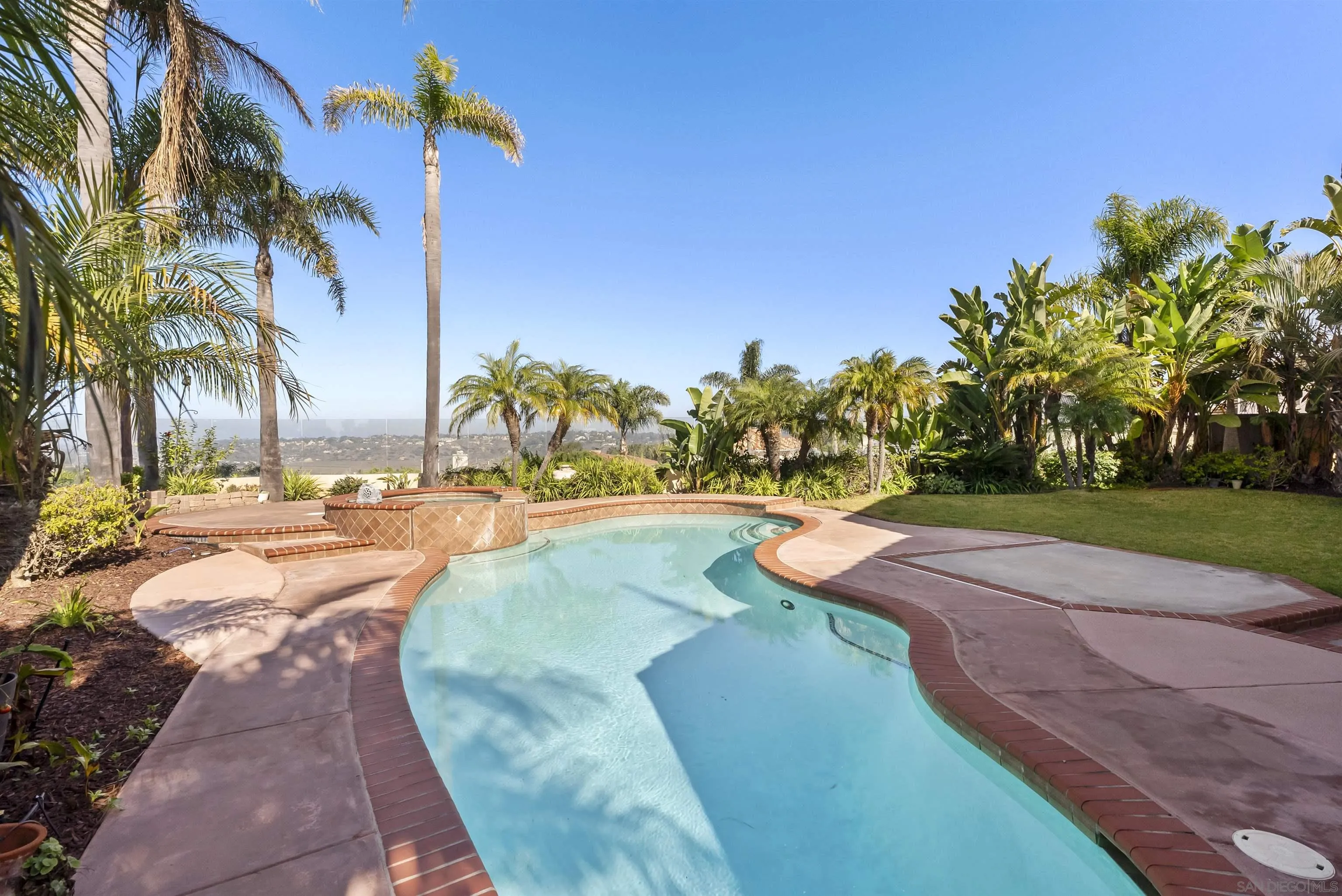 13404 Kibbings Road San Diego, CA 92130 - Photo 32 of 32 a view of a swimming pool with a yard