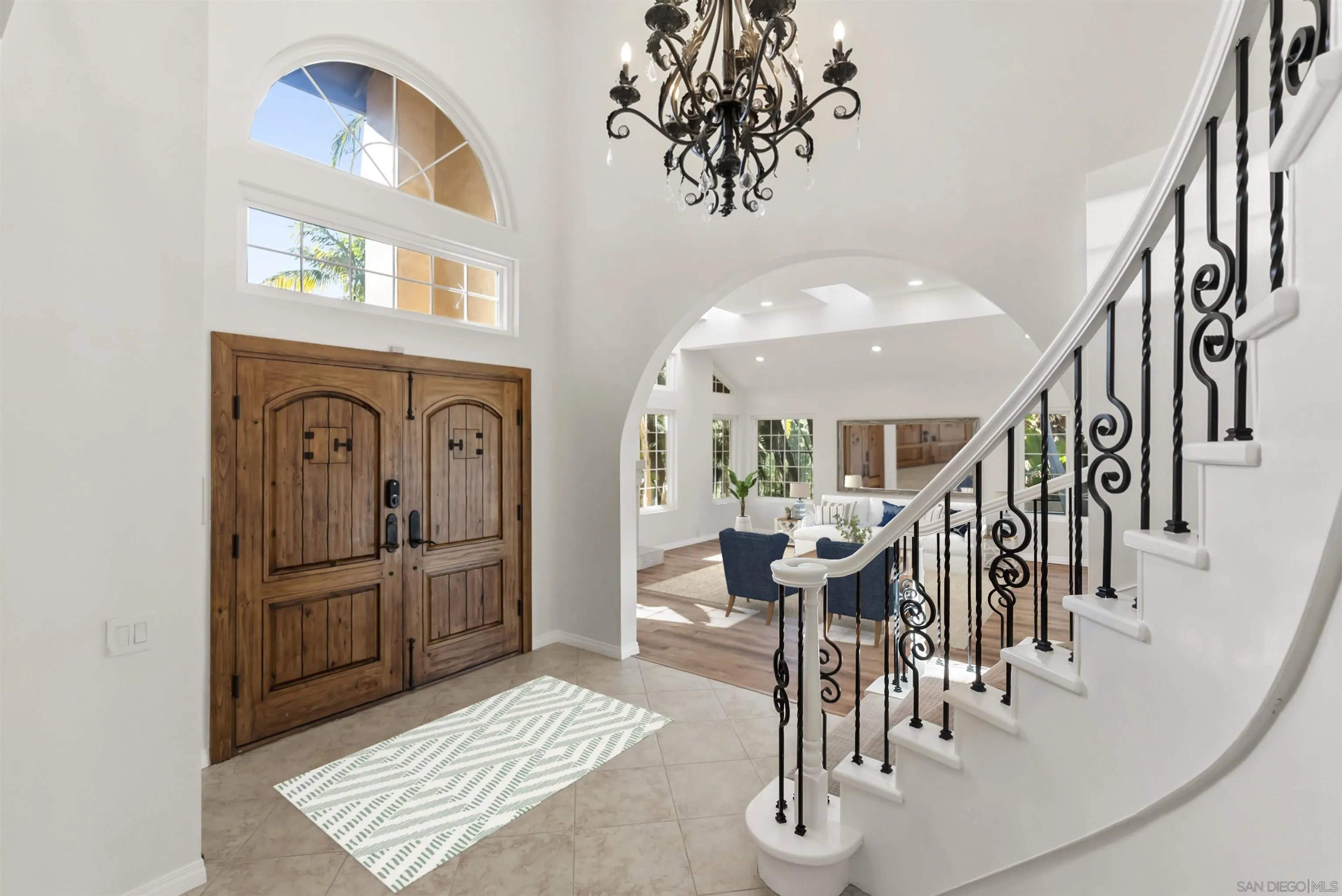 13404 Kibbings Road San Diego, CA 92130 - Photo 7 of 32 a view of a livingroom with kitchen and furniture