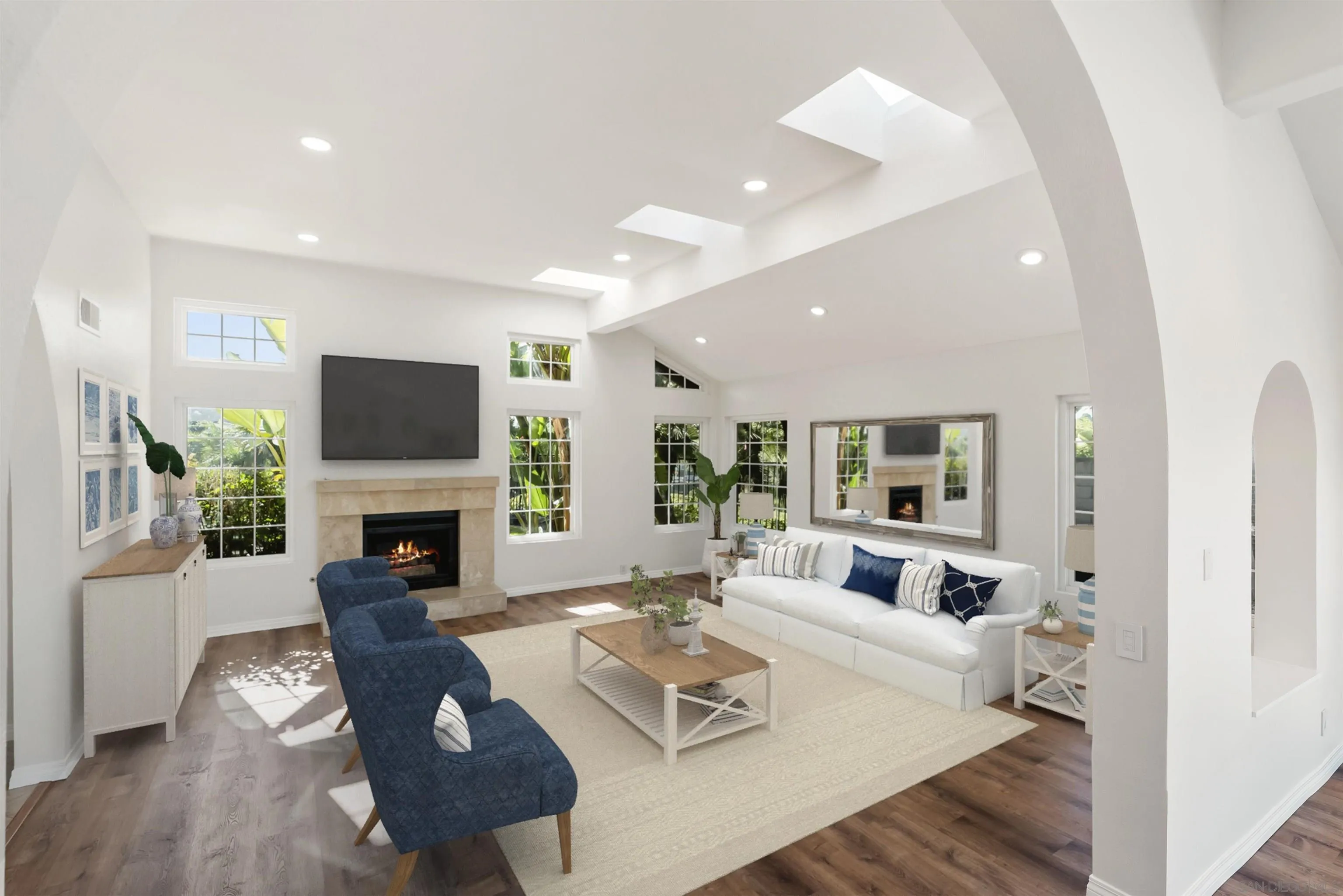 13404 Kibbings Road San Diego, CA 92130 - Photo 10 of 32 a living room with furniture a fireplace and a flat screen tv