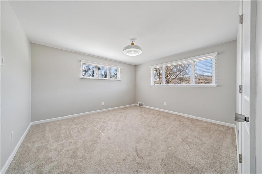 1352 Powers Run Road Pittsburgh, PA 15238 - Photo 29 of 41 The first floor features matching bedrooms with new flooring, paint, and lighting.