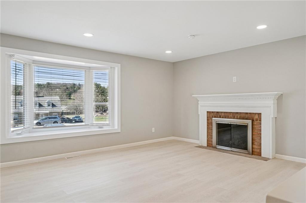 1352 Powers Run Road Pittsburgh, PA 15238 - Photo 5 of 41 The living/dining area features a gas fireplace.
