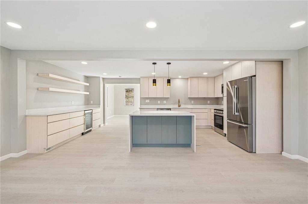 1352 Powers Run Road Pittsburgh, PA 15238 - Photo 6 of 41 New flooring throughout and sleek lighting helps the main living and dining area shine brightly.