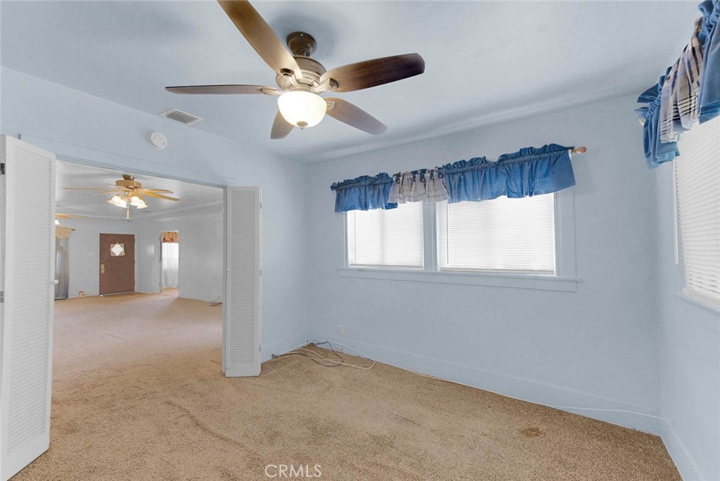 220 East Duarte Road Arcadia, CA 91006 - Photo 6 of 10 en view interior of a house with a chandelier fan and a window