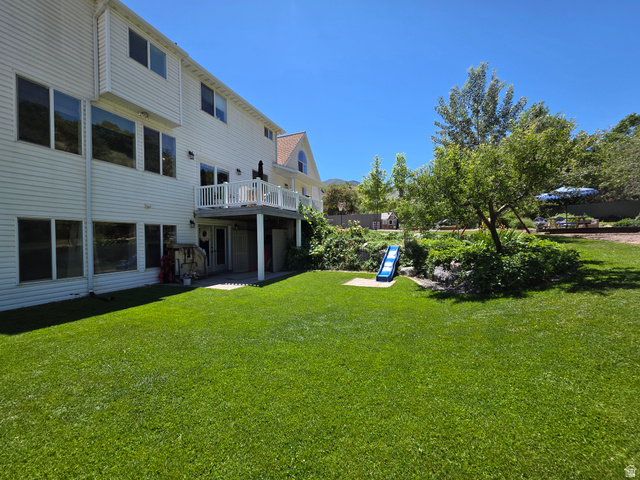 387 North Loafer Canyon Road Payson, UT 84651 - Photo 61 of 94 Expansive backyard featuring a large green lawn and mature trees