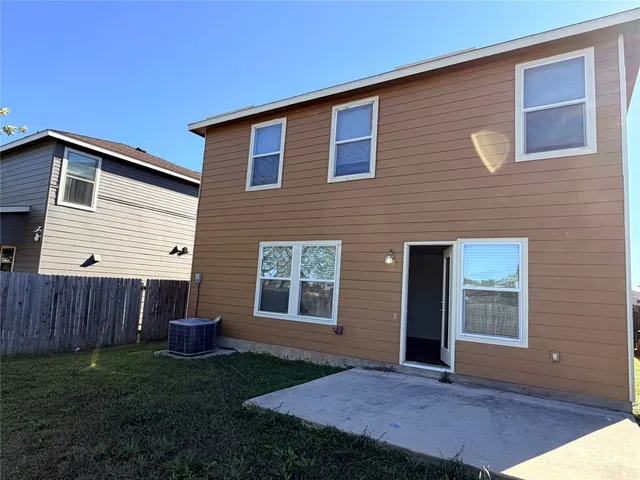 a view of backyard with seating space