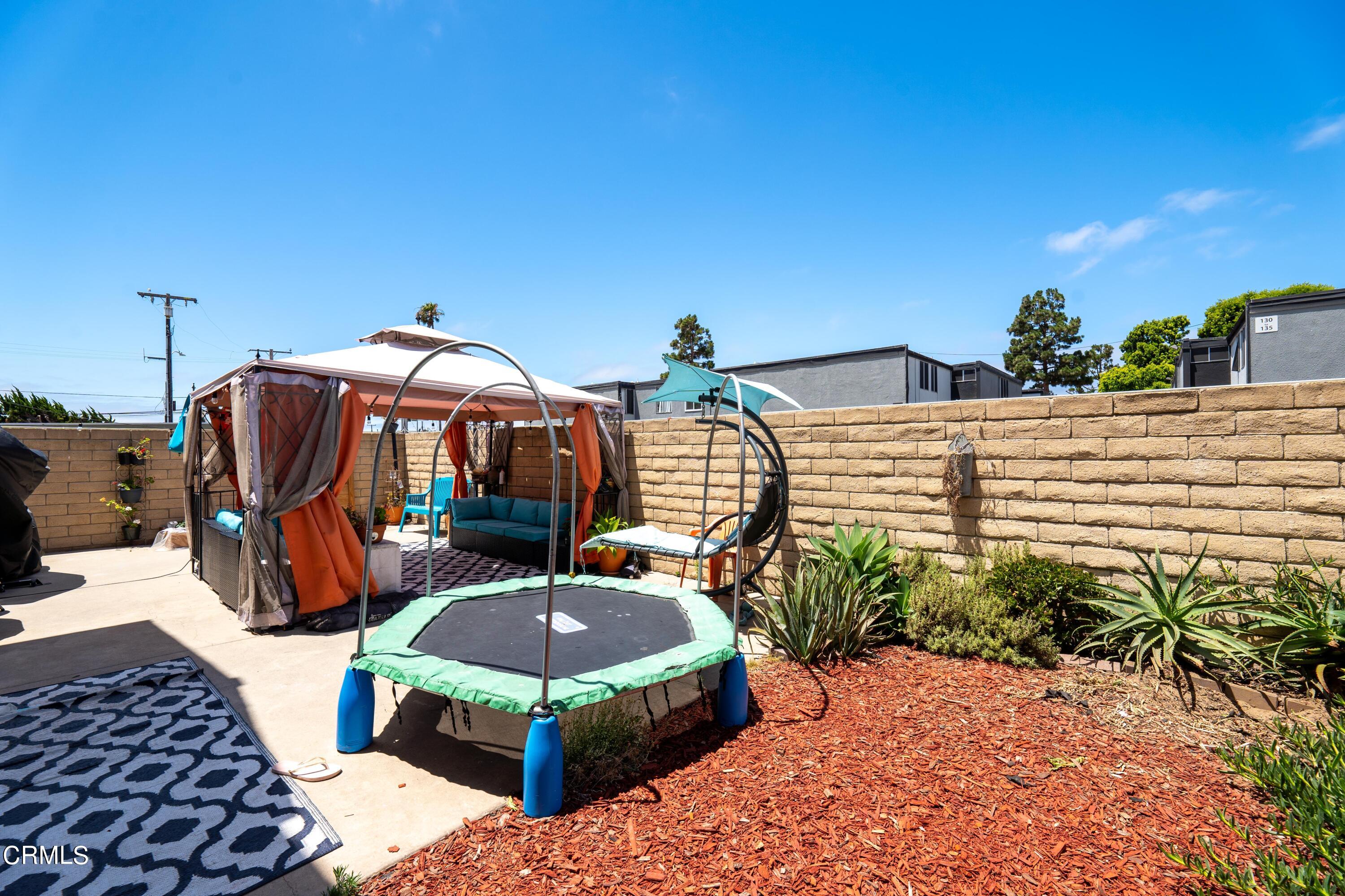 5319 Perkins Road Oxnard, CA 93033 - Photo 14 of 24 a view of a terrace with chairs and potted plants