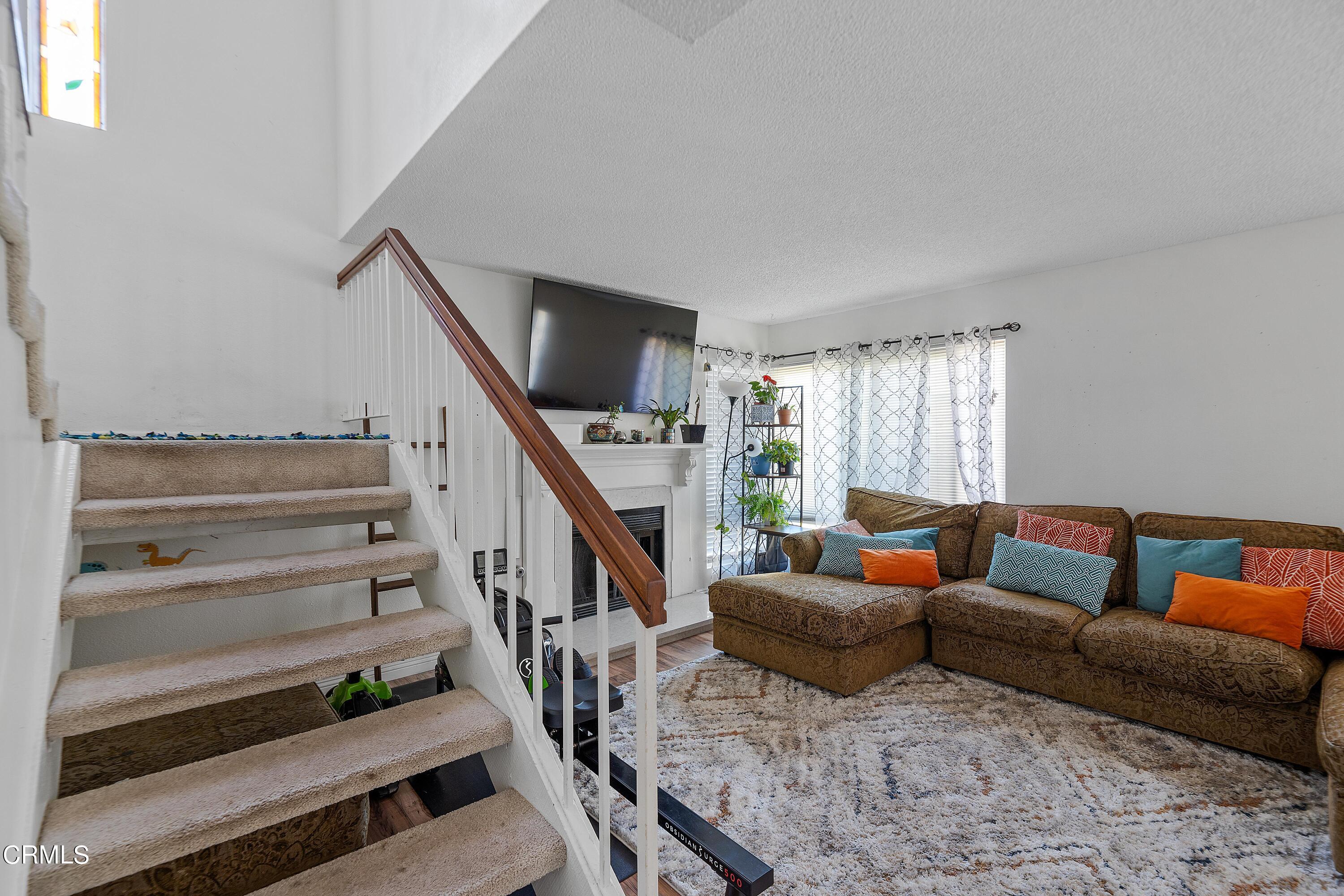 5319 Perkins Road Oxnard, CA 93033 - Photo 16 of 24 a living room with furniture and a potted plant