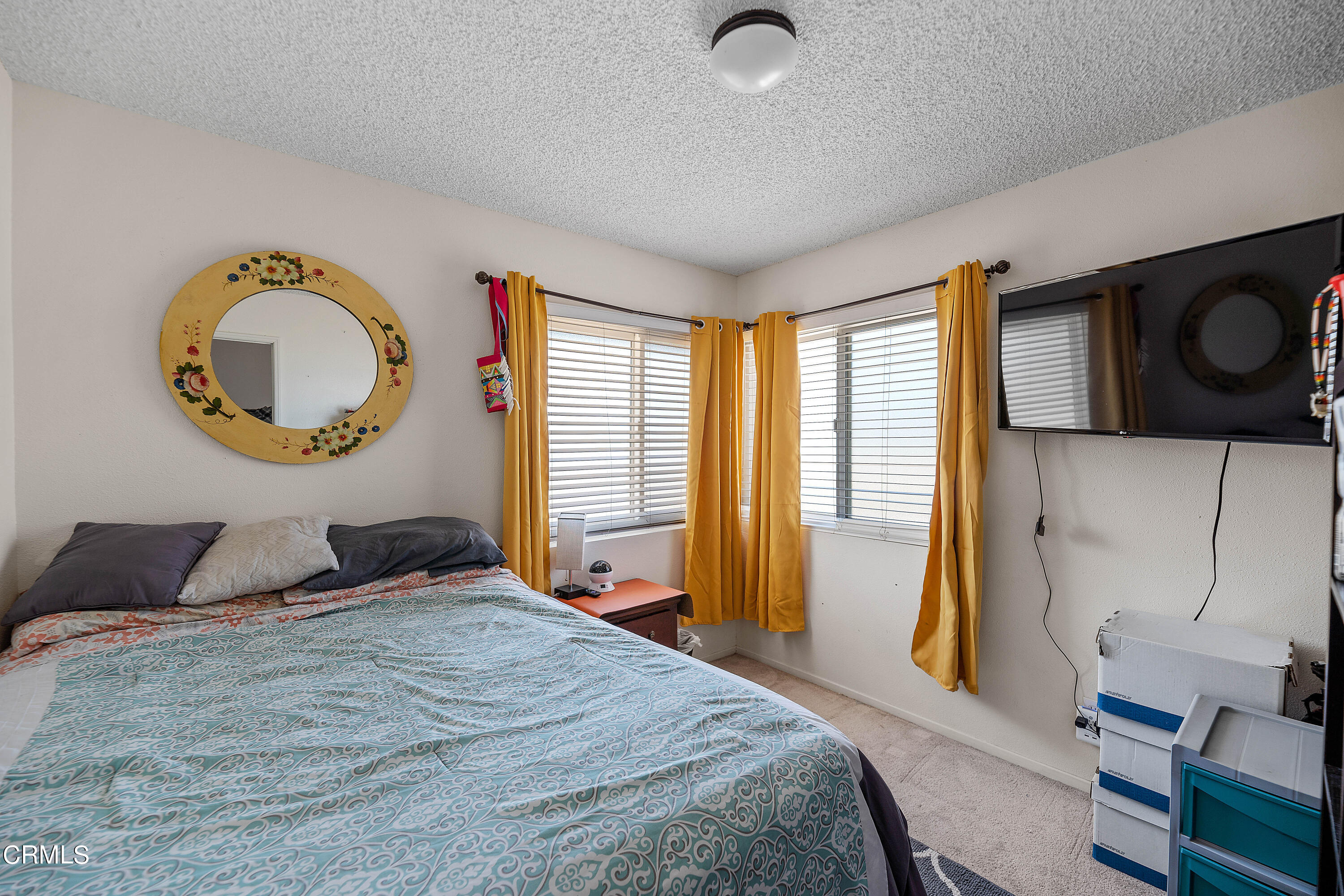 5319 Perkins Road Oxnard, CA 93033 - Photo 17 of 24 a bedroom with a large bed and a window