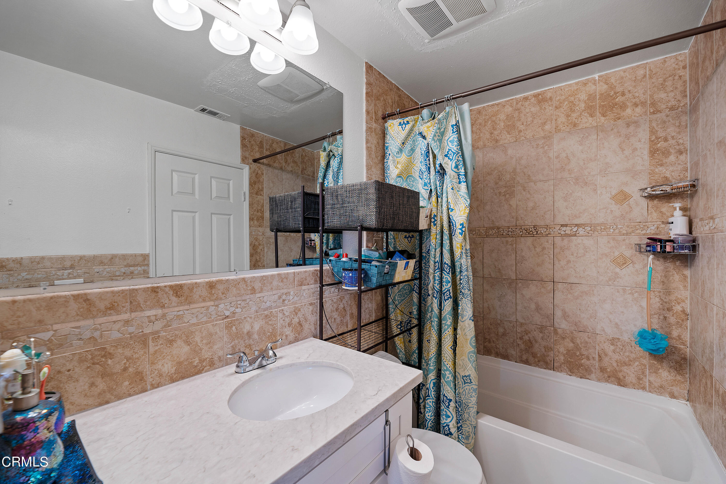 5319 Perkins Road Oxnard, CA 93033 - Photo 22 of 24 a bathroom with a sink and a mirror