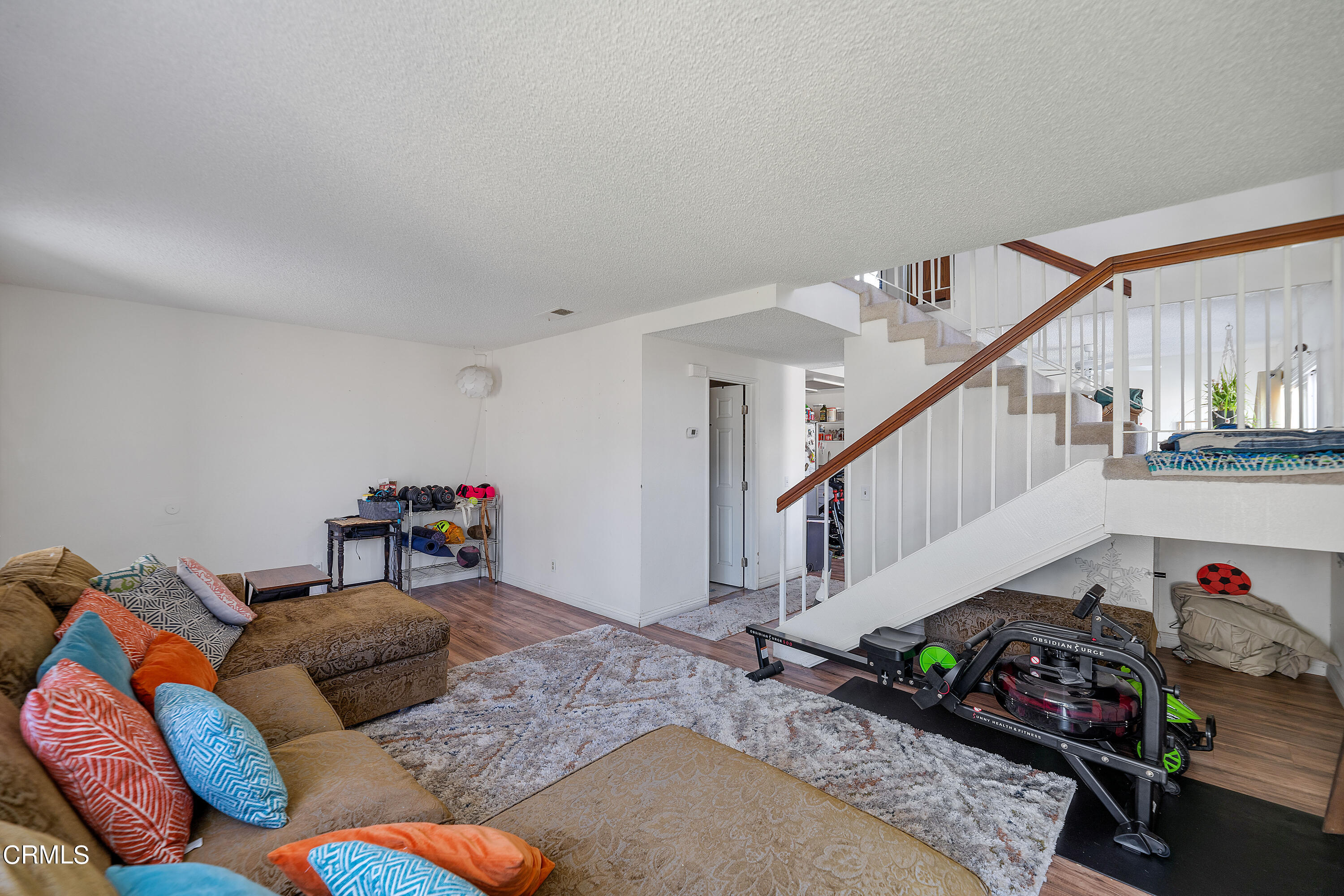5319 Perkins Road Oxnard, CA 93033 - Photo 7 of 24 a living room with furniture and stairs